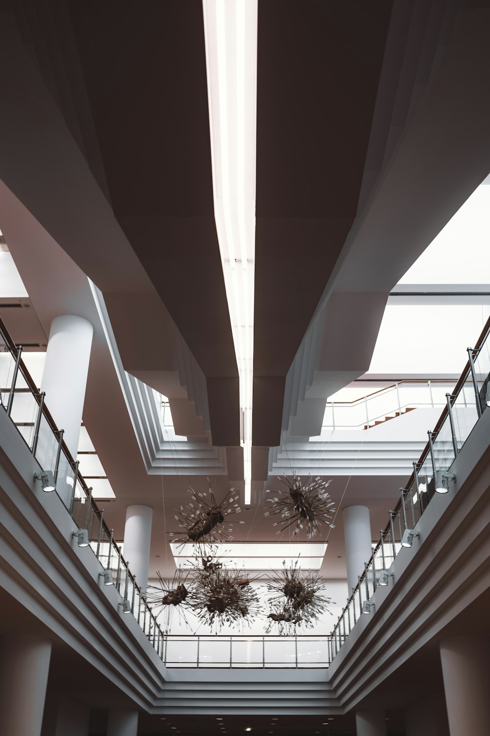 a large building with a bunch of plants hanging from the ceiling