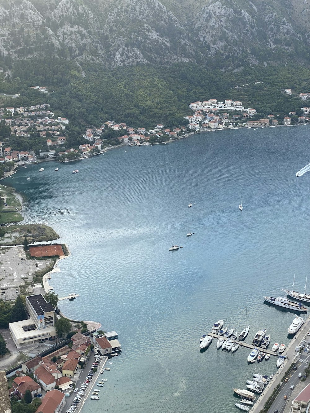 an aerial view of a marina with boats in the water