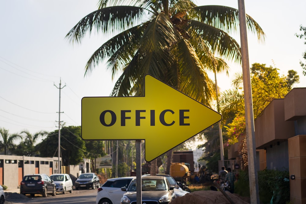 a yellow sign that says office on it