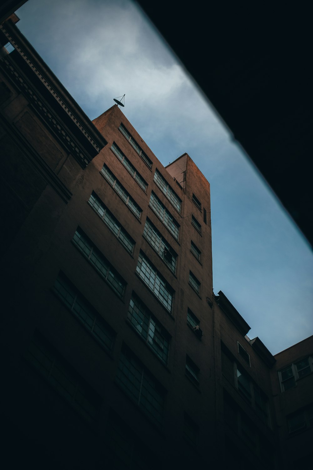 a tall building with a sky in the background