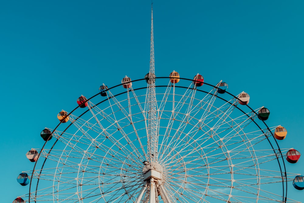 a ferris wheel with a blue sky in the background