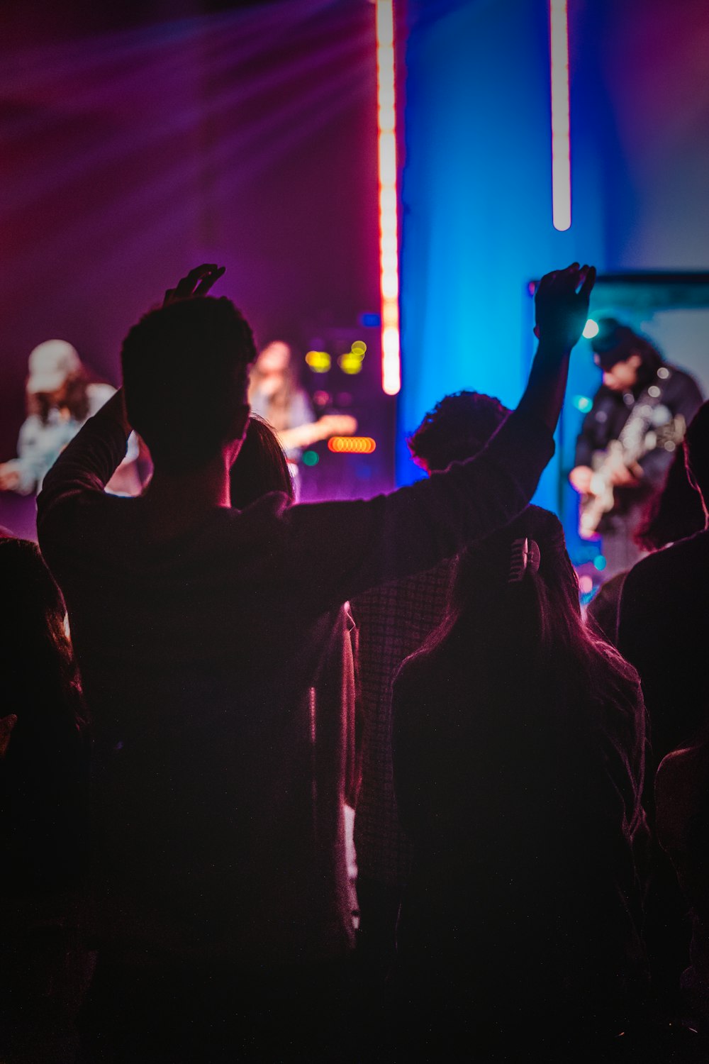 a group of people that are standing in the dark