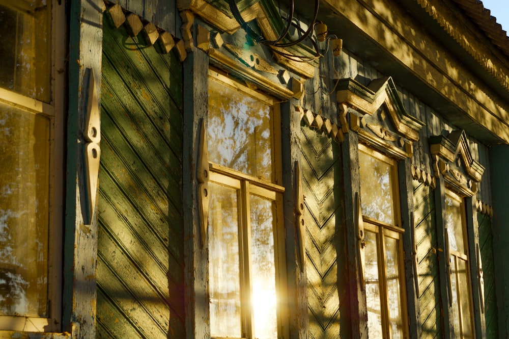 the sun shines through the windows of an old building