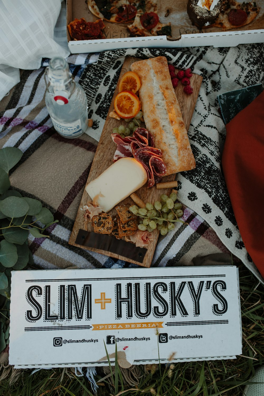 a box of food sitting on top of a blanket