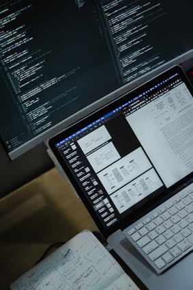 a laptop computer sitting on top of a desk