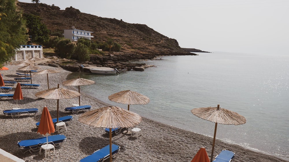 a bunch of umbrellas that are on a beach