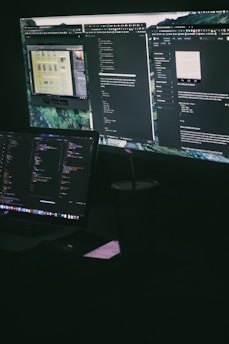a computer monitor sitting on top of a desk