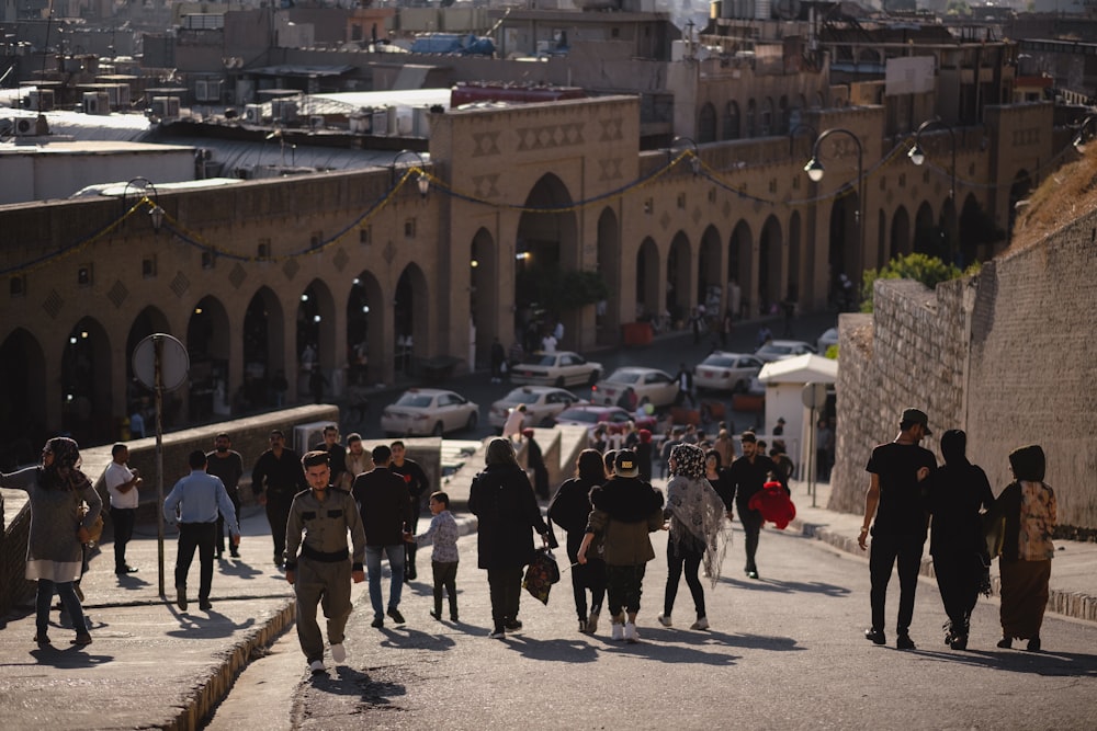 a group of people walking down a street