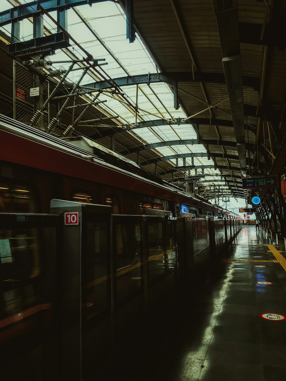 a train pulling into a train station next to a platform