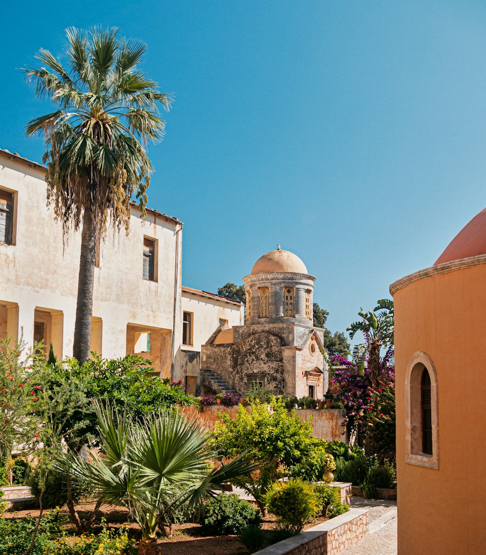 a building with a dome in the middle of a garden