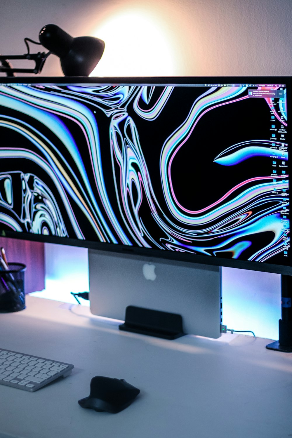 a computer monitor sitting on top of a desk