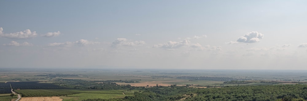 a view of the countryside from the top of a hill