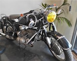 A fully restored vintage motorcycle gleaming under workshop lights, ready for the road.