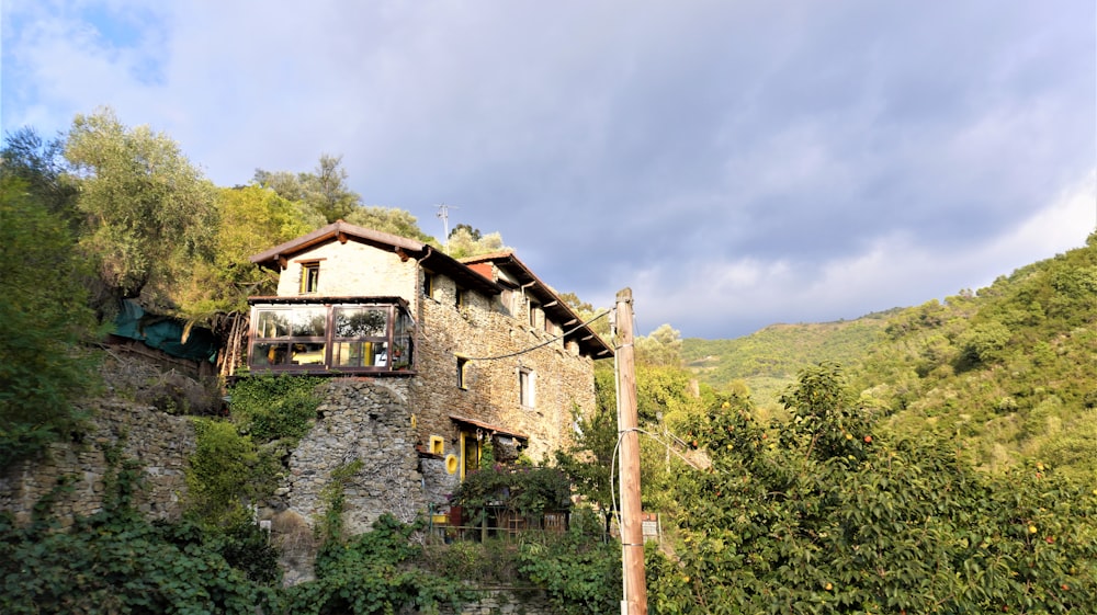 a stone building with a balcony on the top of it