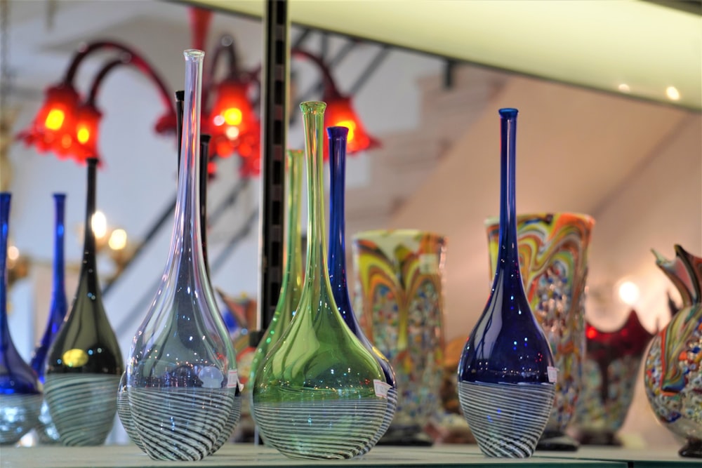 a group of vases sitting on top of a table