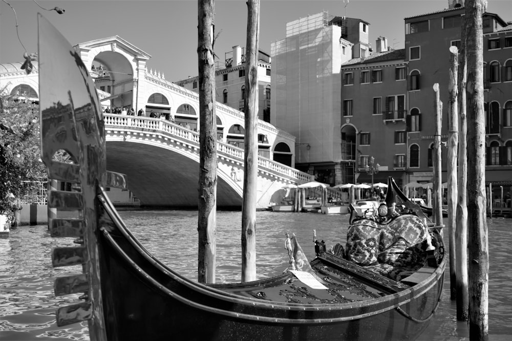 a black and white photo of a gondola in venice