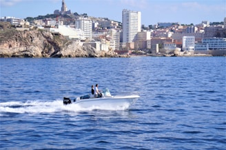 two people on a small boat in the water