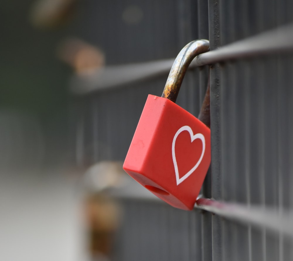 a red padlock with a heart on it