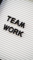 a sign that says team work on it