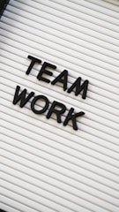 a sign that says team work on it