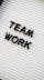 a sign that says team work on it