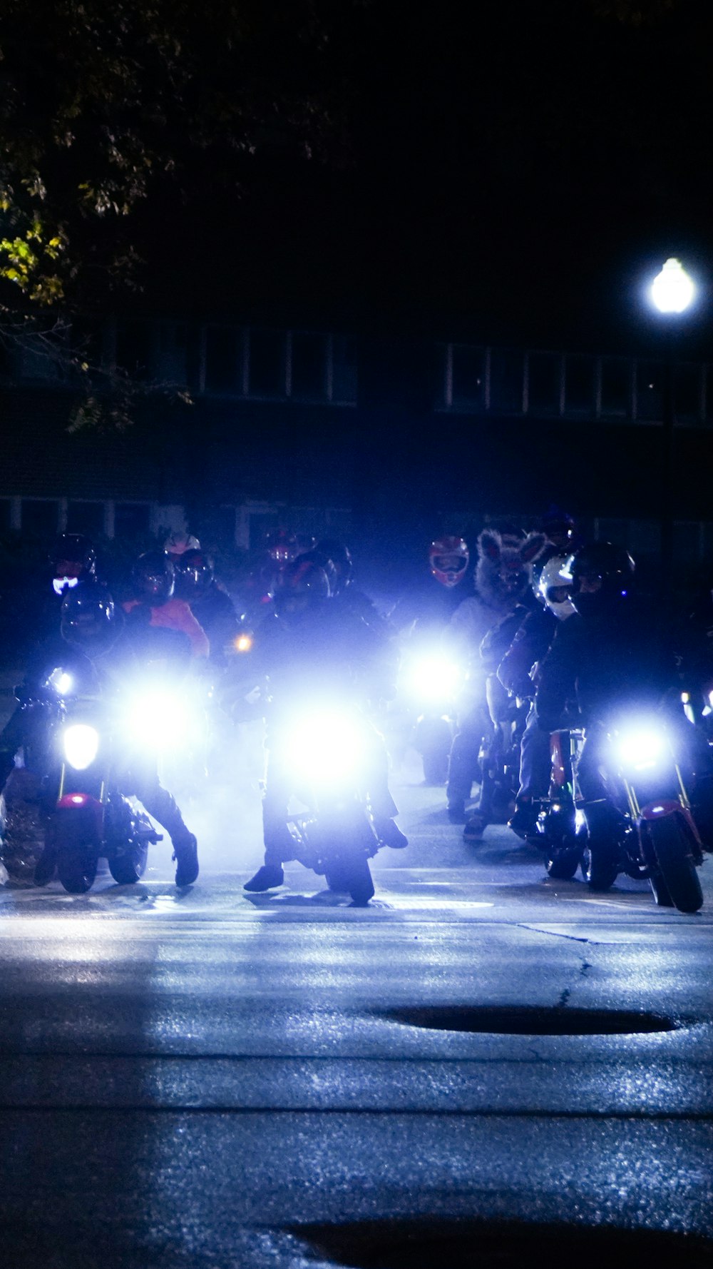 a group of police officers on motorcycles at night