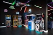 a room filled with arcade machines and neon lights