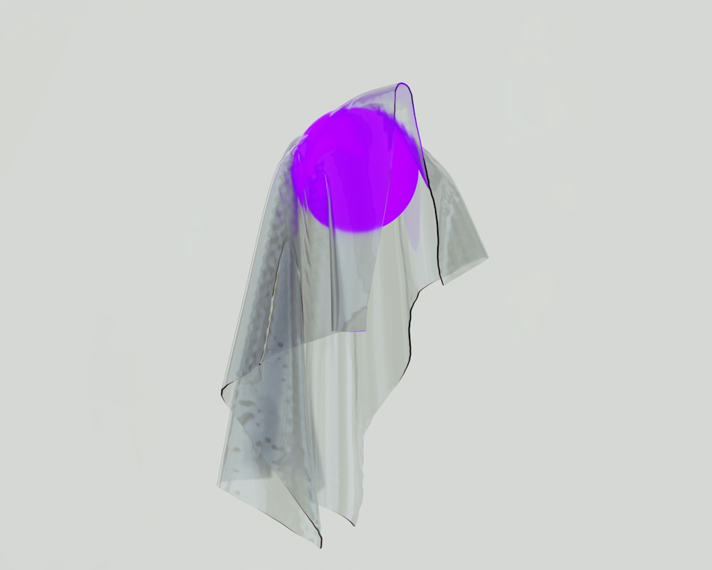 a purple object is floating in the air