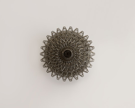 a metal object on a white surface