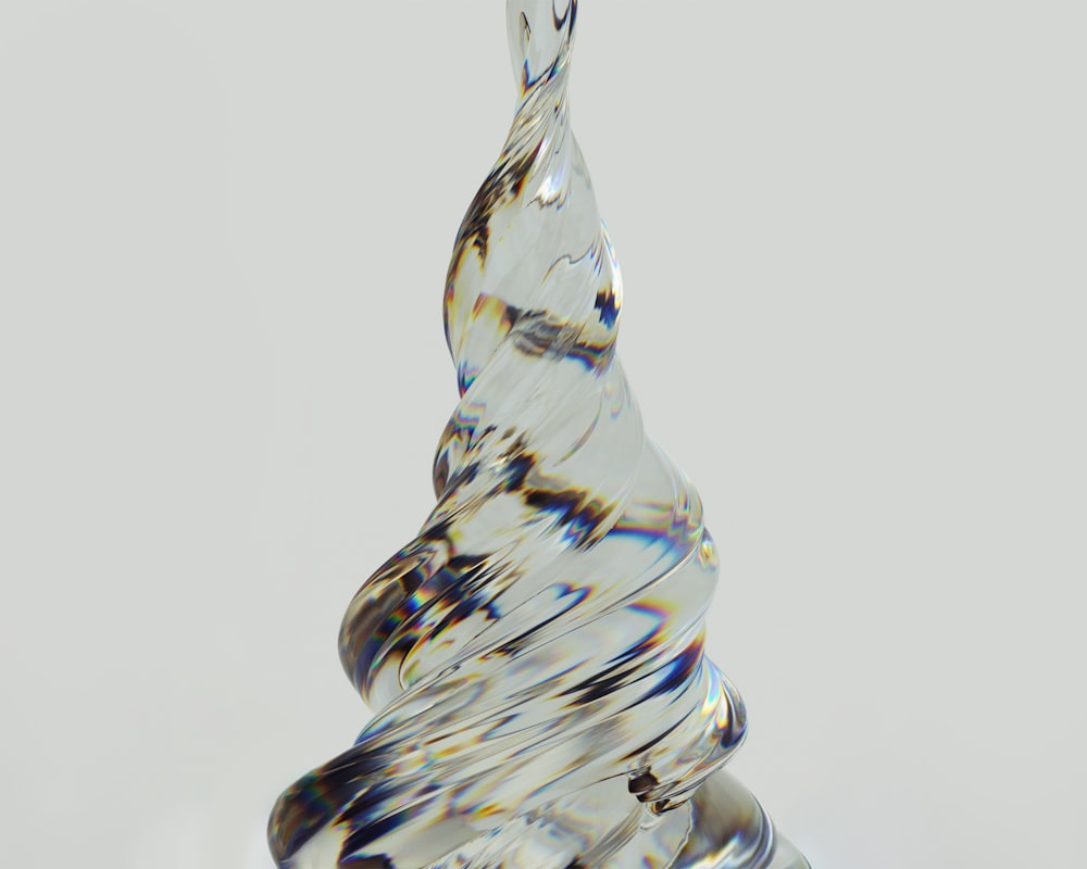 a glass sculpture of a tree on a table