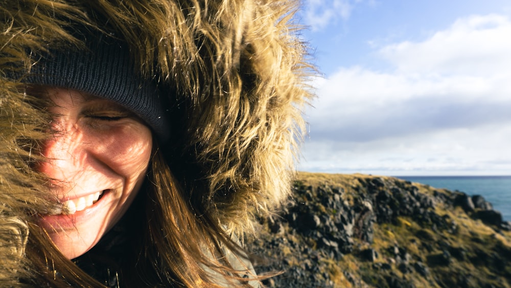 a woman wearing a furry hat and a furry coat