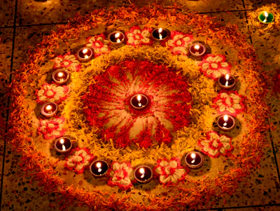 Circular arrangement of lit diyas for Diwali