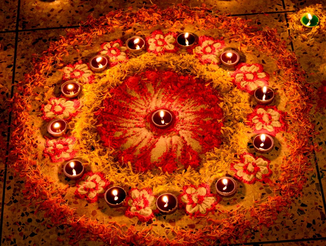 a circular arrangement of candles on a floor,