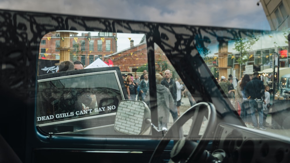 a reflection of a car in the side view mirror