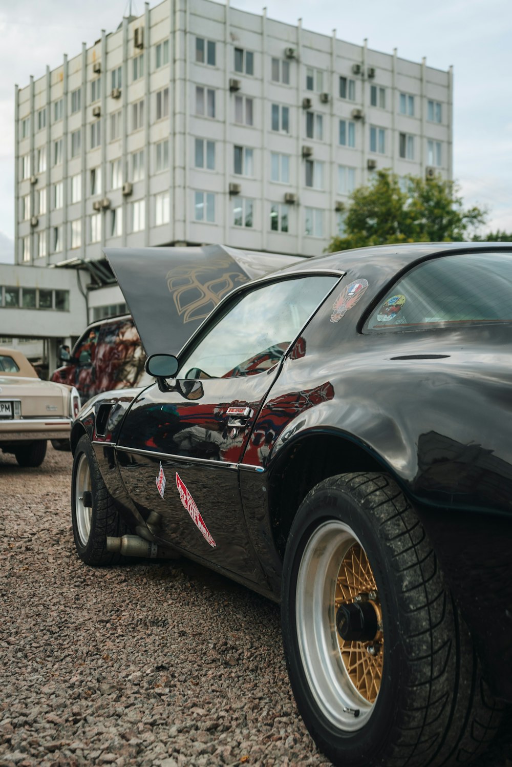 a black sports car parked in a parking lot