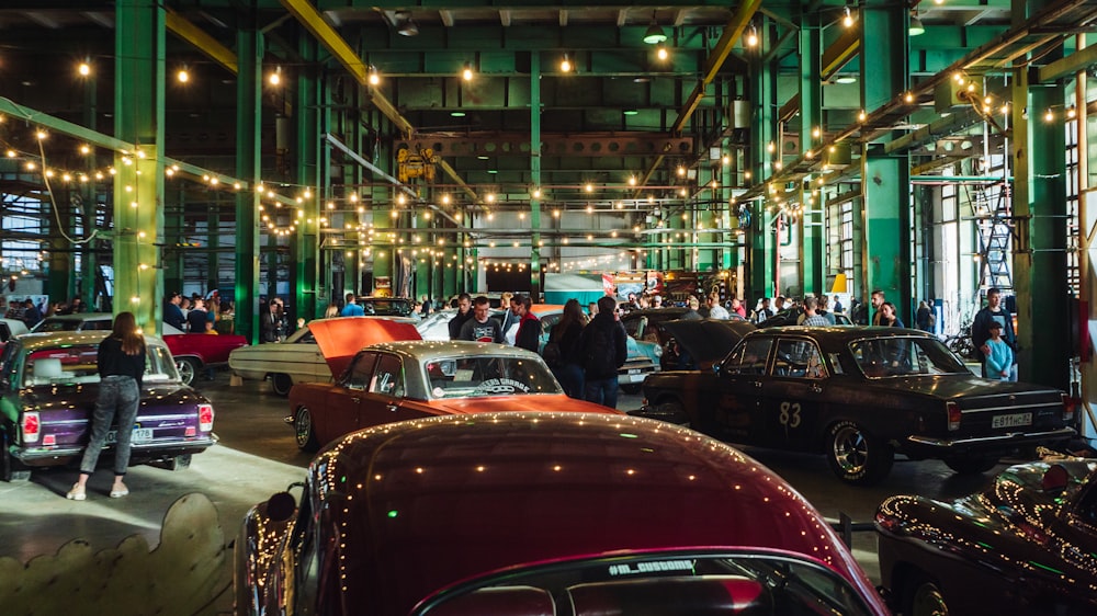 a group of cars parked inside of a building