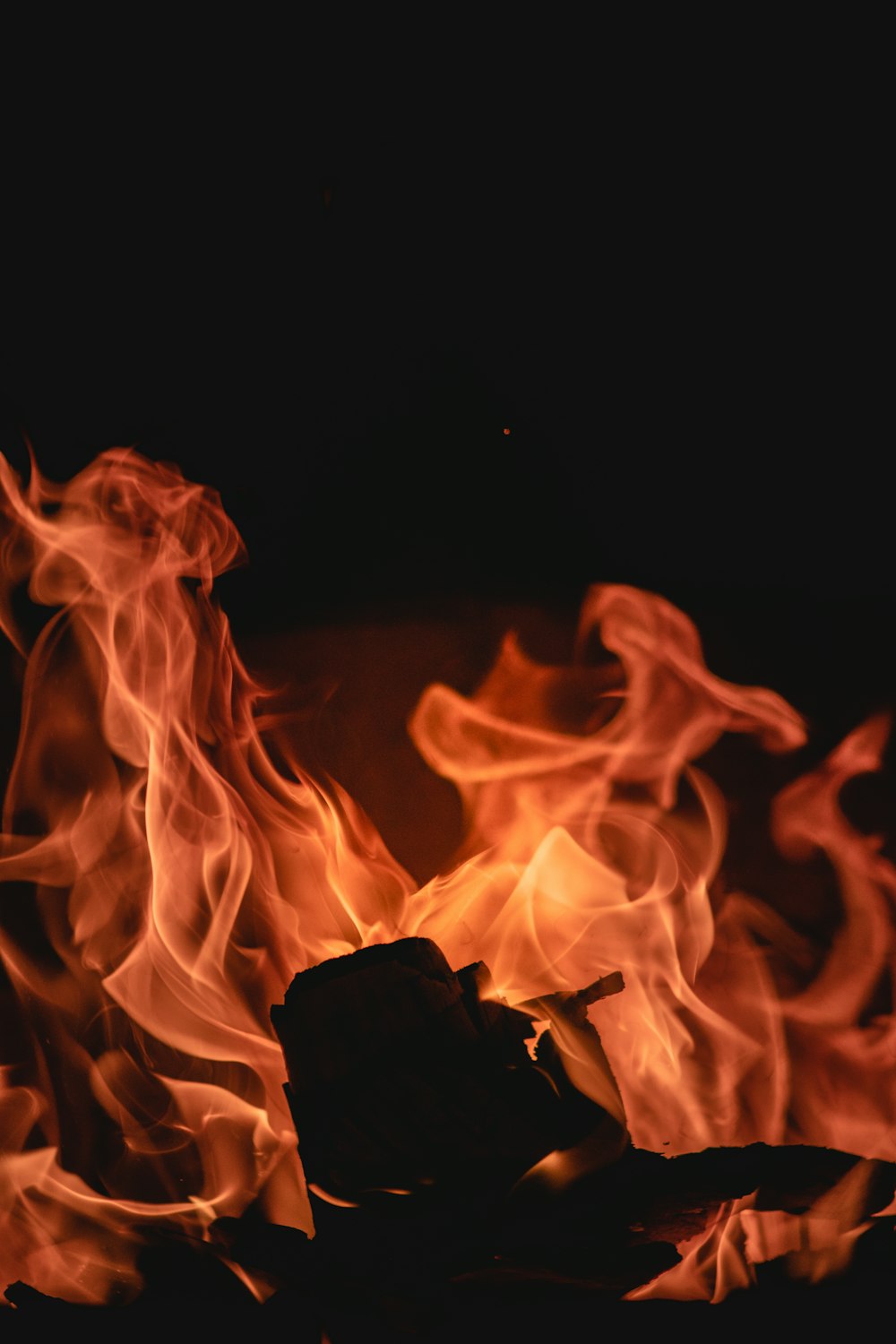 a close up of a fire in the dark