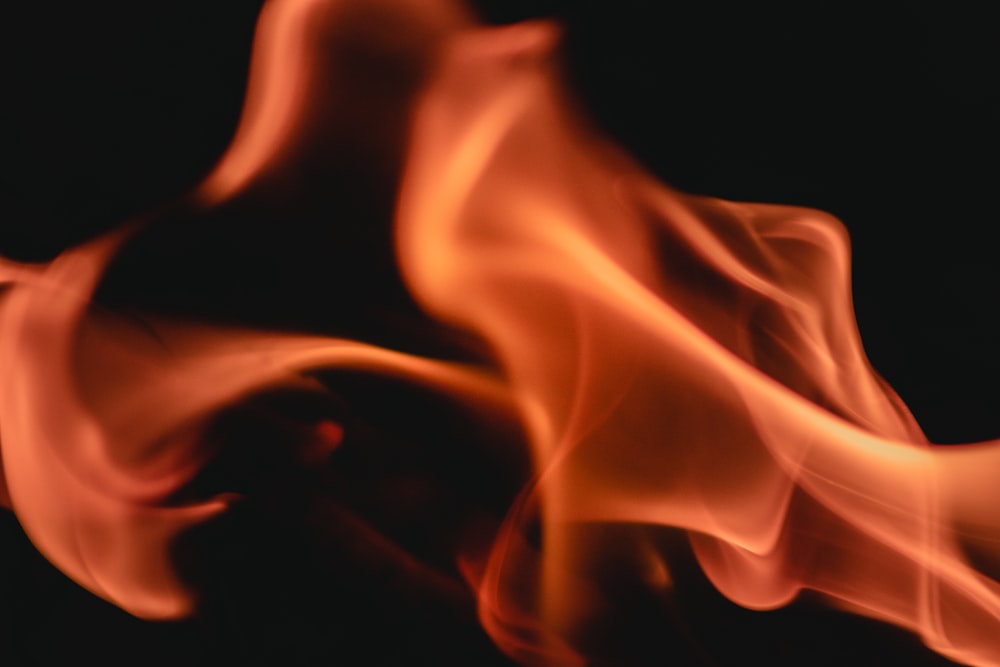 a close up of a fire on a black background