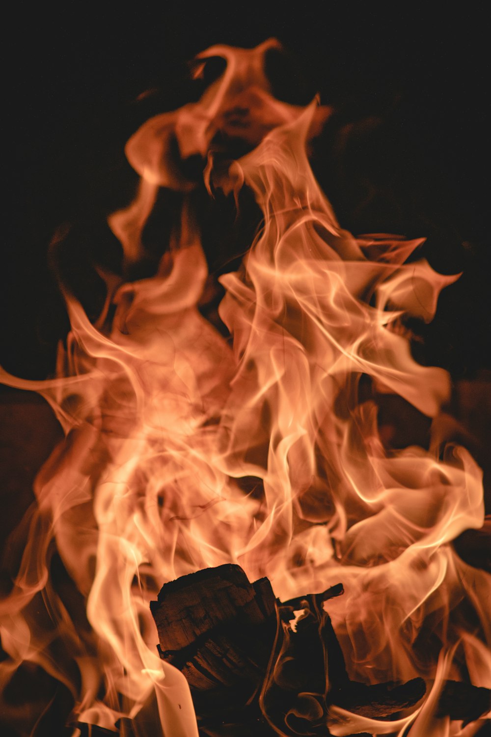 a close up of a fire with lots of flames