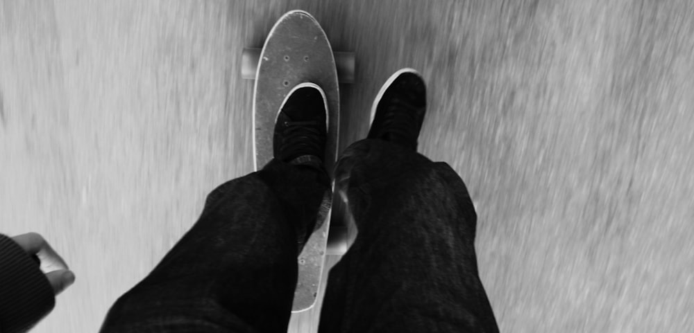 a person riding a skateboard down a street