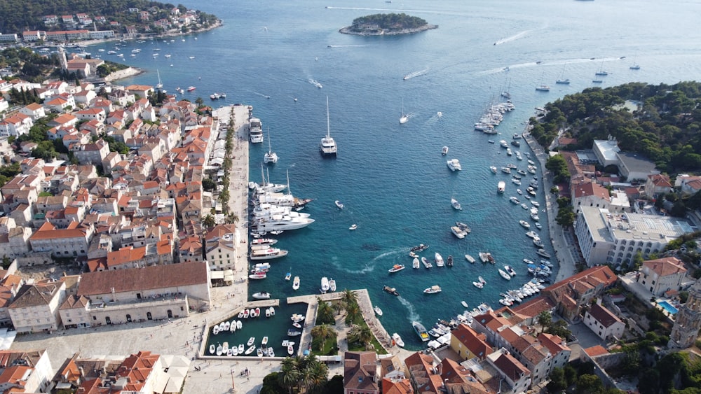 an aerial view of a harbor with boats in the water