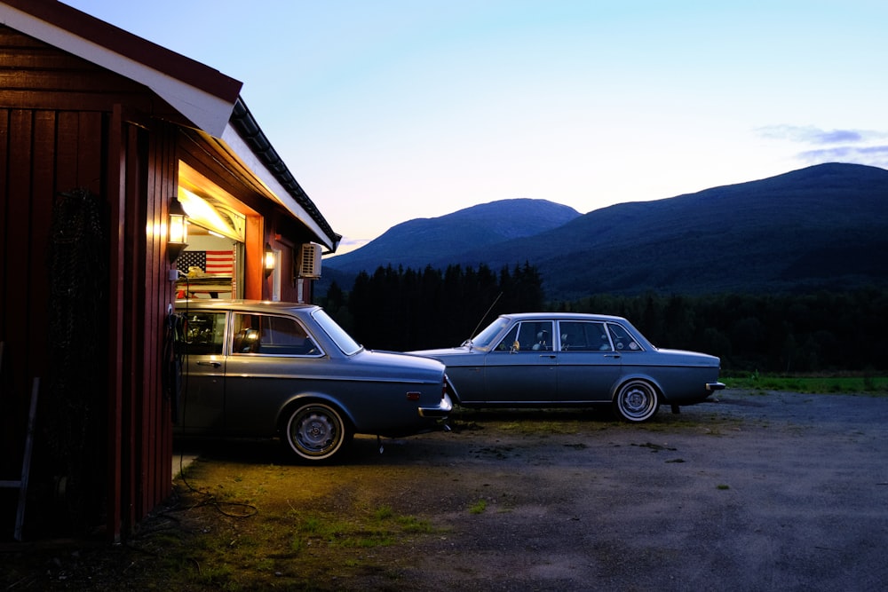 a couple of cars parked next to a building