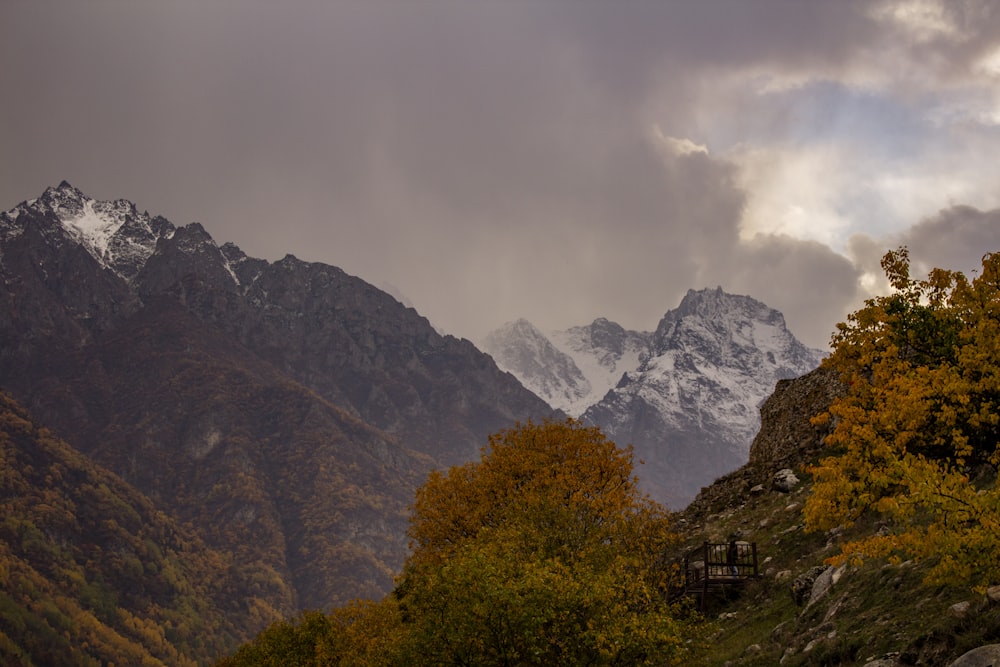 a view of a mountain range with clouds in the sky