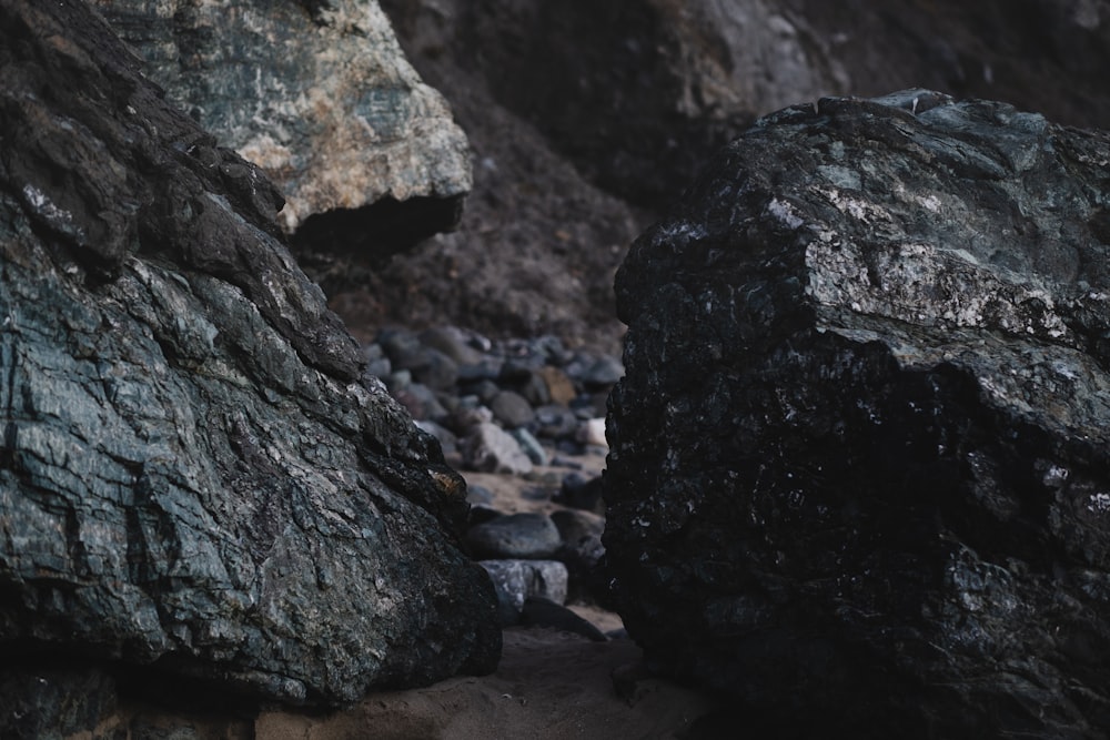 a couple of large rocks sitting next to each other