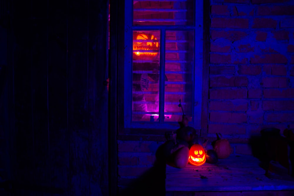 a couple of pumpkins sitting on top of a table