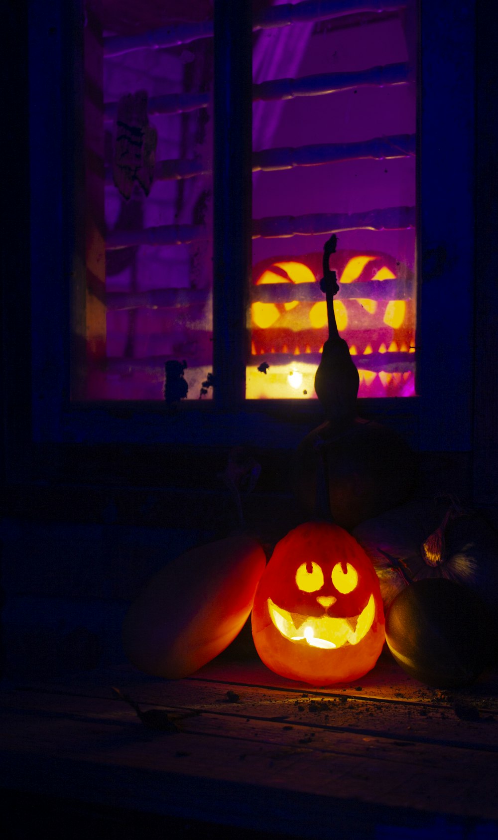 a couple of pumpkins sitting on top of a table