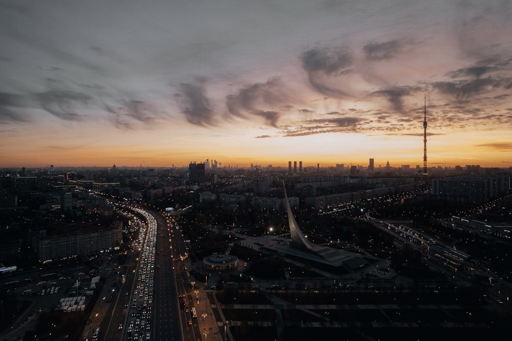 an aerial view of a city at sunset