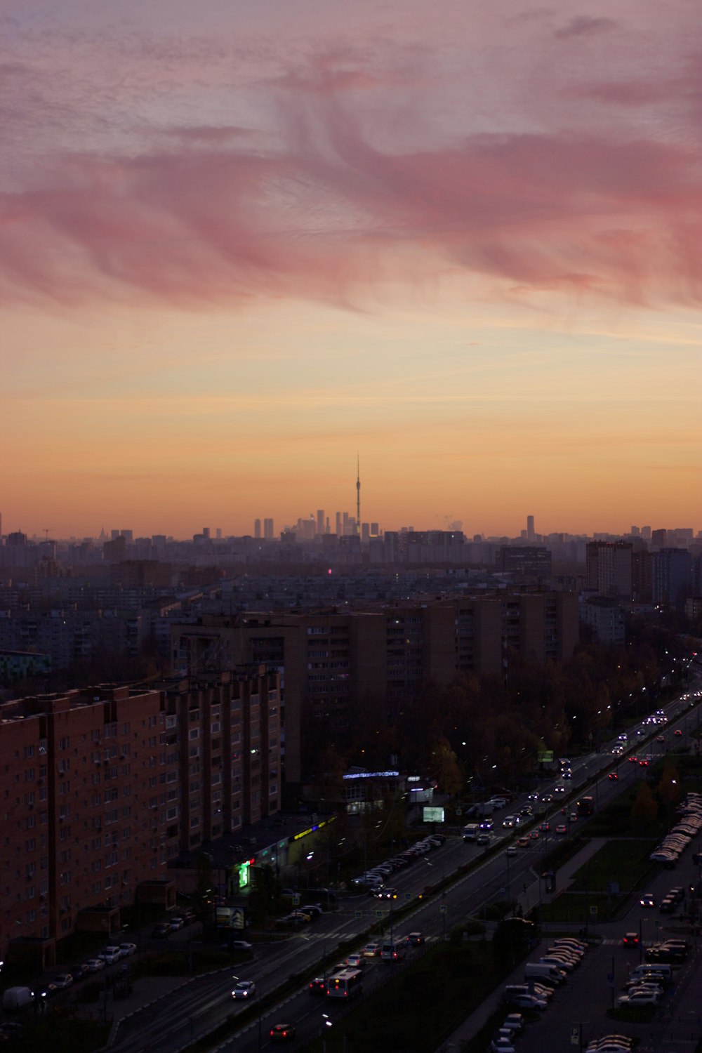 a view of a city at sunset from a tall building