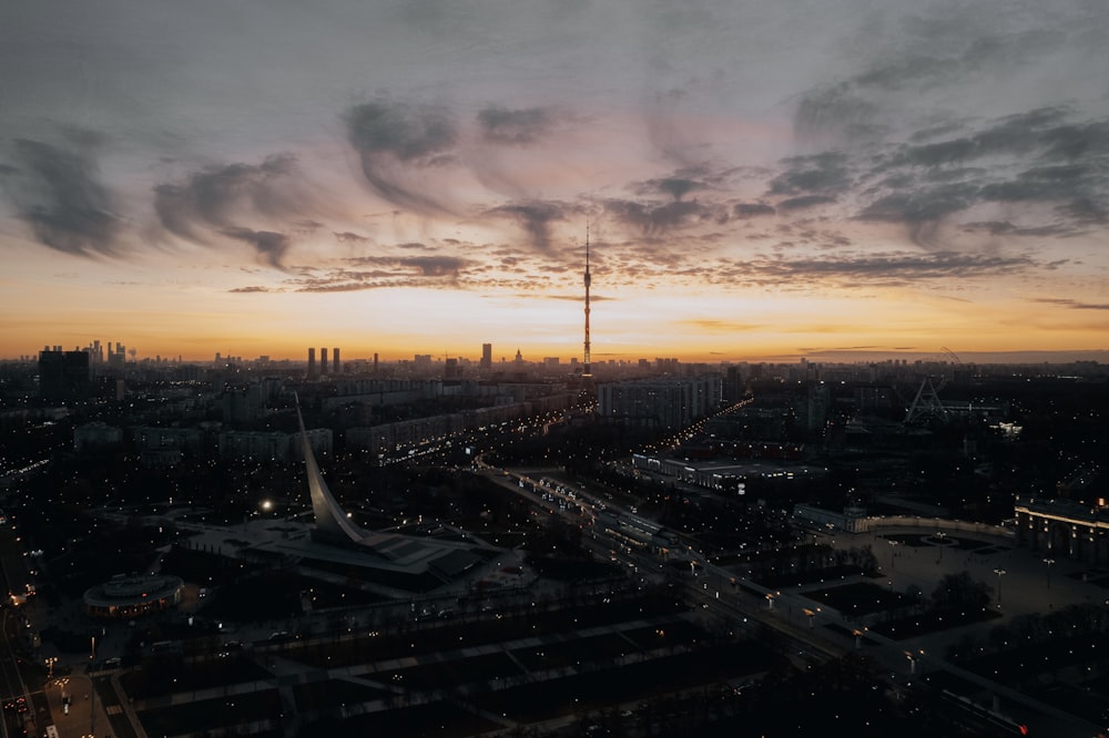 an aerial view of a city at sunset