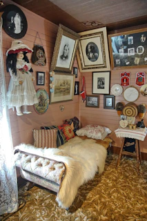 A cozy nook featuring a mix of vintage and eccentric cushions and throws